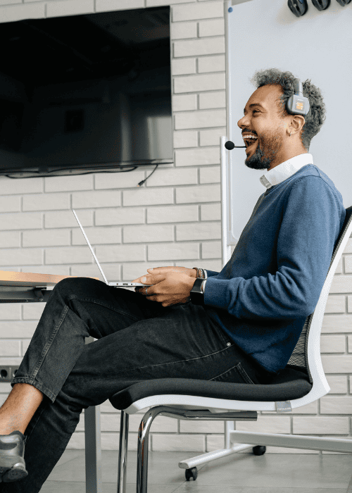Man smiling and happy at work after receiving individual therapy in Hong Kong