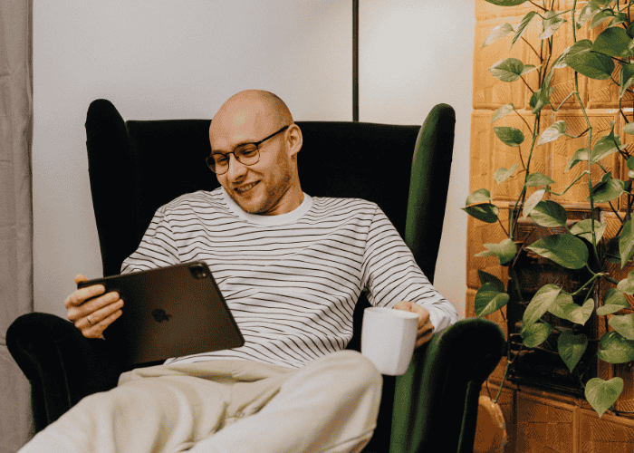 Man on a virtual therapy session smiling after his adhd test