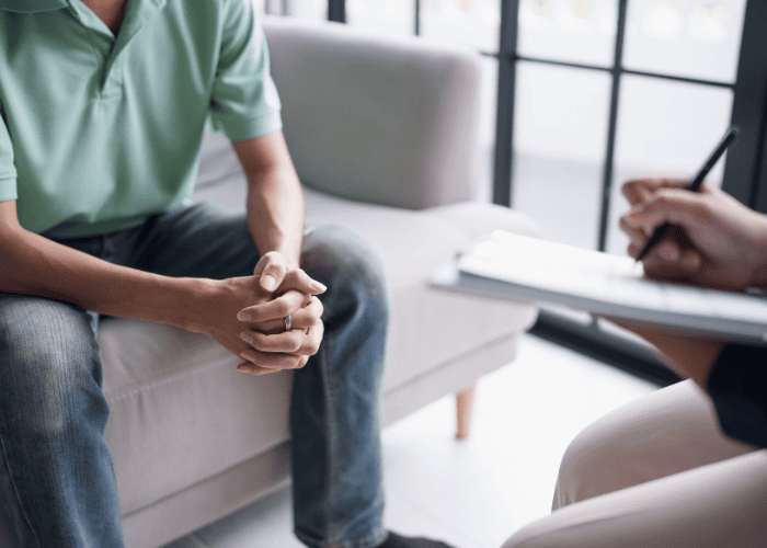 Man in trauma-informed therapy session